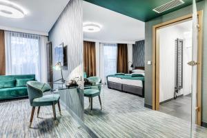 Posteľ alebo postele v izbe v ubytovaní Hotel Traugutta3