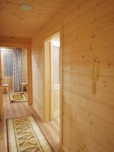 a wooden room with a door and a window at Domek Anielci in Zakopane