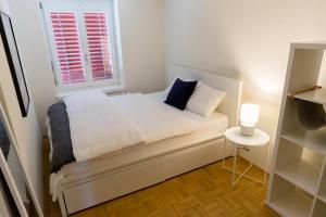Ein Bett oder Betten in einem Zimmer der Unterkunft Keyforge City Apartments Waldstätterstrasse 10