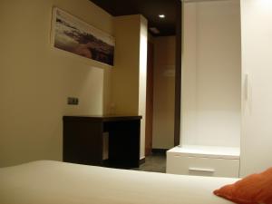 Postel nebo postele na pokoji v ubytování Hotel Can Batiste