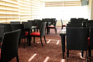 
a dining room table with chairs and tables at Olive Hotel in Amman
