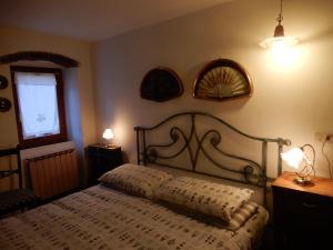 Postel nebo postele na pokoji v ubytování Il Borgo della Colomba