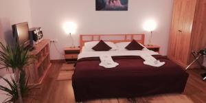Ein Bett oder Betten in einem Zimmer der Unterkunft Apartmán B 101 Vysoké Tatry