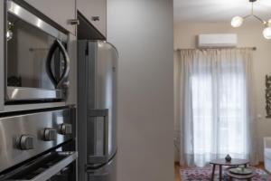 Kuchyňa alebo kuchynka v ubytovaní Absolute Athens VI