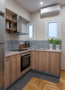 A kitchen or kitchenette at Absolute Athens VII