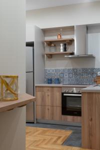 A kitchen or kitchenette at Absolute Athens VII