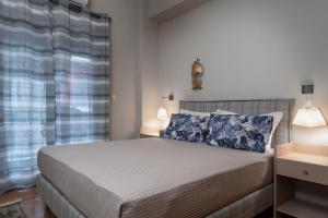 A bed or beds in a room at Absolute Athens VII