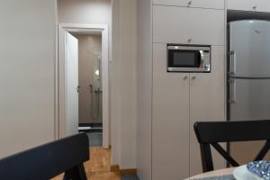 A television and/or entertainment centre at Absolute Athens VII