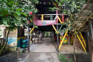 a play area with a playground with a tree at The Humpback Turtle in El Valle