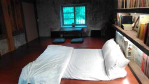 Voodi või voodid majutusasutuse Yilan For A Night B&B toas
