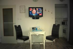 TV a/nebo společenská místnost v ubytování Ferienwohnung Osterdeich