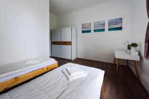 Кровать или кровати в номере Gold Apartment - Győr +3 фотографии