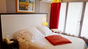 Llit o llits en una habitació de Le Mas des Ecureuils