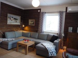 a living room with a couch and a table at Holiday home Hammarstrand 4 persons in Hammarstrand