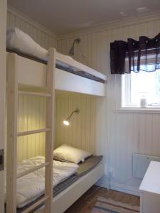 a bunk bed room with two bunk beds and a window at Holiday home Hammarstrand 4 persons in Hammarstrand