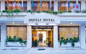 a large building with a large window in front of it at Nefeli Hotel in Chania Town