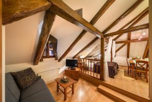 a living room with a couch and a table at Castle View Apartments in Český Krumlov