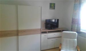 A television and/or entertainment centre at Apartment MASCH