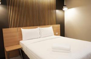 Postel nebo postele na pokoji v ubytování So good Hotel Bangkok