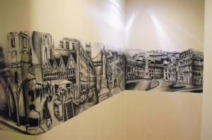 a drawing of a city on a wall at Residence Metro-Alameda in Lisbon