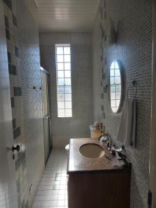 Um banheiro em Hotel Platanus