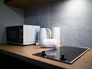 Príslušenstvo na prípravu kávy alebo čaju v ubytovaní Apartamenty Białystok - Botaniczna 9A/21