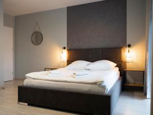 Posteľ alebo postele v izbe v ubytovaní Apartamenty Białystok - Botaniczna 9A/21