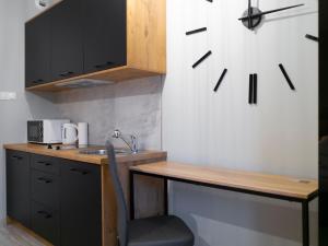 Kuchyňa alebo kuchynka v ubytovaní Apartamenty Białystok - Botaniczna 9A/21