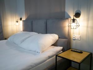 Posteľ alebo postele v izbe v ubytovaní Apartamenty Białystok - Botaniczna 9A/21