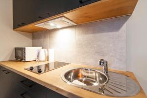 Kuchyňa alebo kuchynka v ubytovaní Apartamenty Białystok - Botaniczna 9A/21