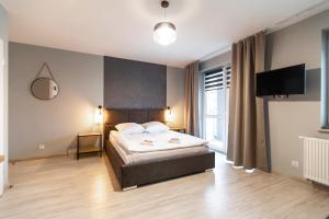 Posteľ alebo postele v izbe v ubytovaní Apartamenty Białystok - Botaniczna 9A/21