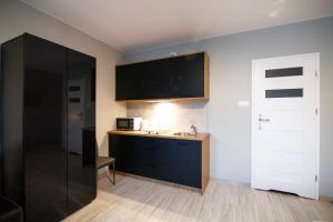 Kuchyňa alebo kuchynka v ubytovaní Apartamenty Białystok - Botaniczna 9A/21