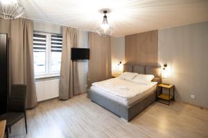 Posteľ alebo postele v izbe v ubytovaní Apartamenty Białystok - Botaniczna 9A/21