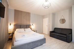 Posteľ alebo postele v izbe v ubytovaní Apartamenty Białystok - Botaniczna 9A/21