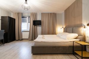 Posteľ alebo postele v izbe v ubytovaní Apartamenty Białystok - Botaniczna 9A/21