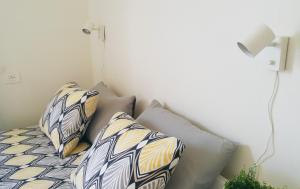 Postel nebo postele na pokoji v ubytování Le Suite Studio 491