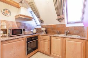 Kuchyňa alebo kuchynka v ubytovaní Apartament Bajeczna Góra Zakopane