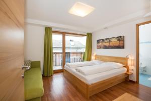 Postel nebo postele na pokoji v ubytování Residence Aichner