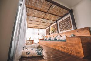 a bedroom with two beds and a large window at Pousada da Prainha in Arraial do Cabo +48 photos