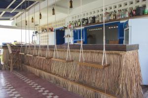 a bar with a long counter with someadders at The Playground in Kampot