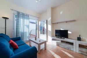 Televízia a/alebo spoločenská miestnosť v ubytovaní Apartamento en Urbanizacion Hacienda Golf Islantilla