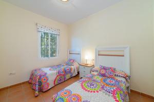 Posteľ alebo postele v izbe v ubytovaní Apartamento en Urbanizacion Hacienda Golf Islantilla