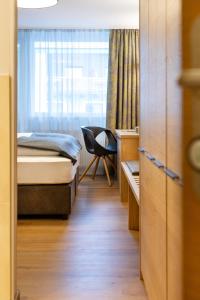Ein Bett oder Betten in einem Zimmer der Unterkunft Hotel Grüner Baum