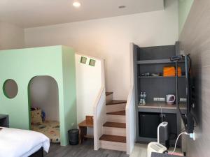 Postel nebo postele na pokoji v ubytování Kai Cheng Inn 旅館134