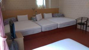 Letto o letti in una camera di Kai Cheng Inn 旅館134