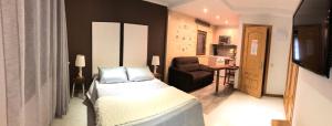 A bed or beds in a room at Hotel Apartamentos Barrau