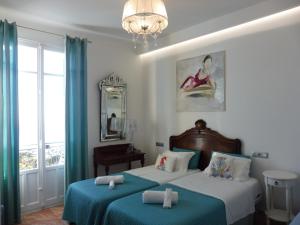 Letto o letti in una camera di Hotel Normandy