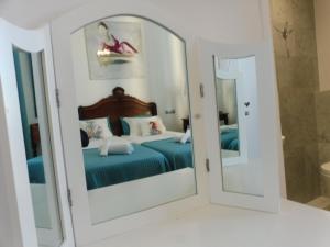 Letto o letti in una camera di Hotel Normandy