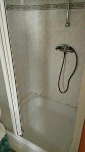 a shower with a faucet in a bathroom at Pension na hranici in Železná Ruda