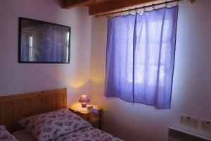 a bedroom with a bed and a window with a lamp at Holiday home at Aquapark Tatralandia in Liptovský Mikuláš +51 photos